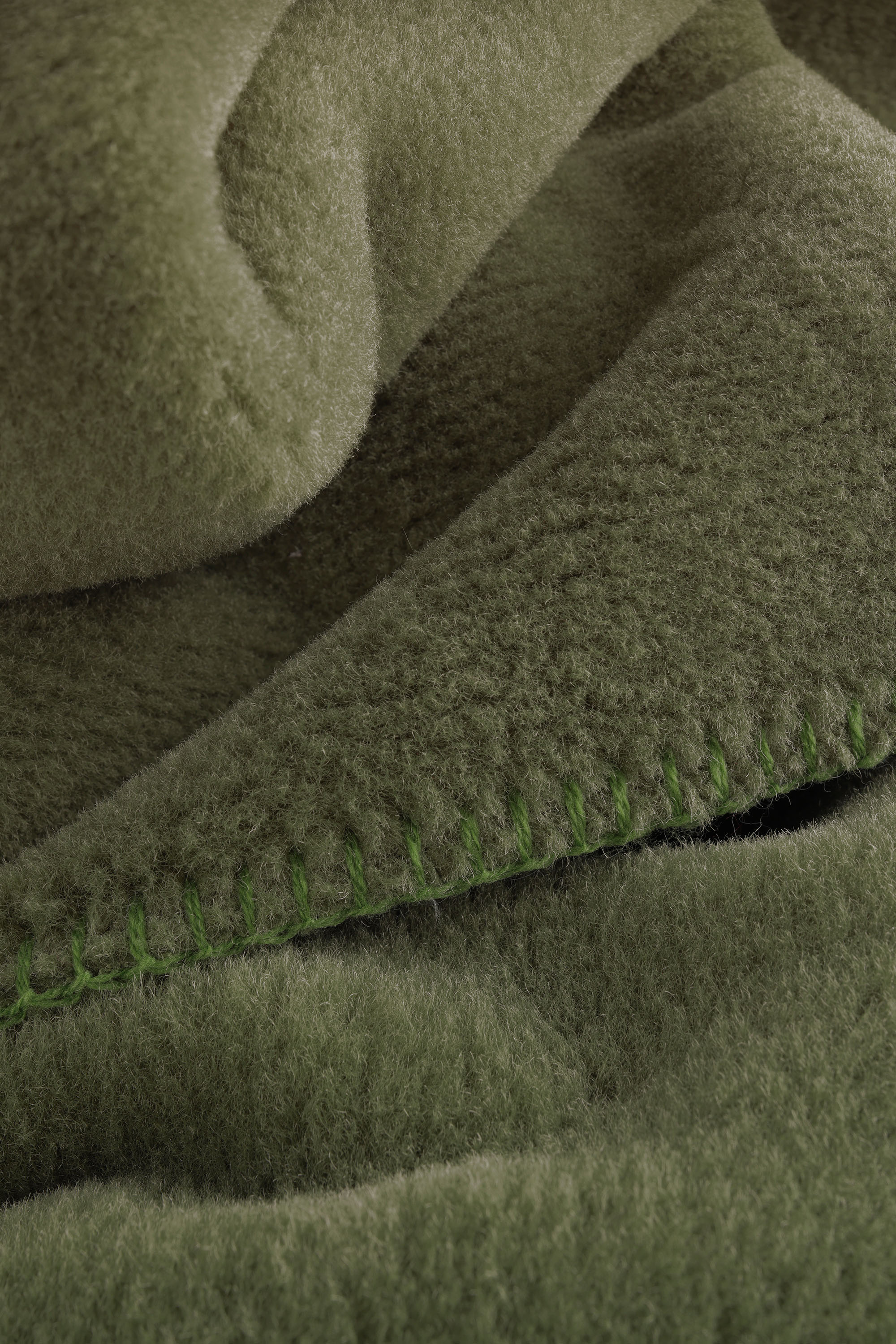 Wohndecke Wool Feel mossy Nahaufnahme